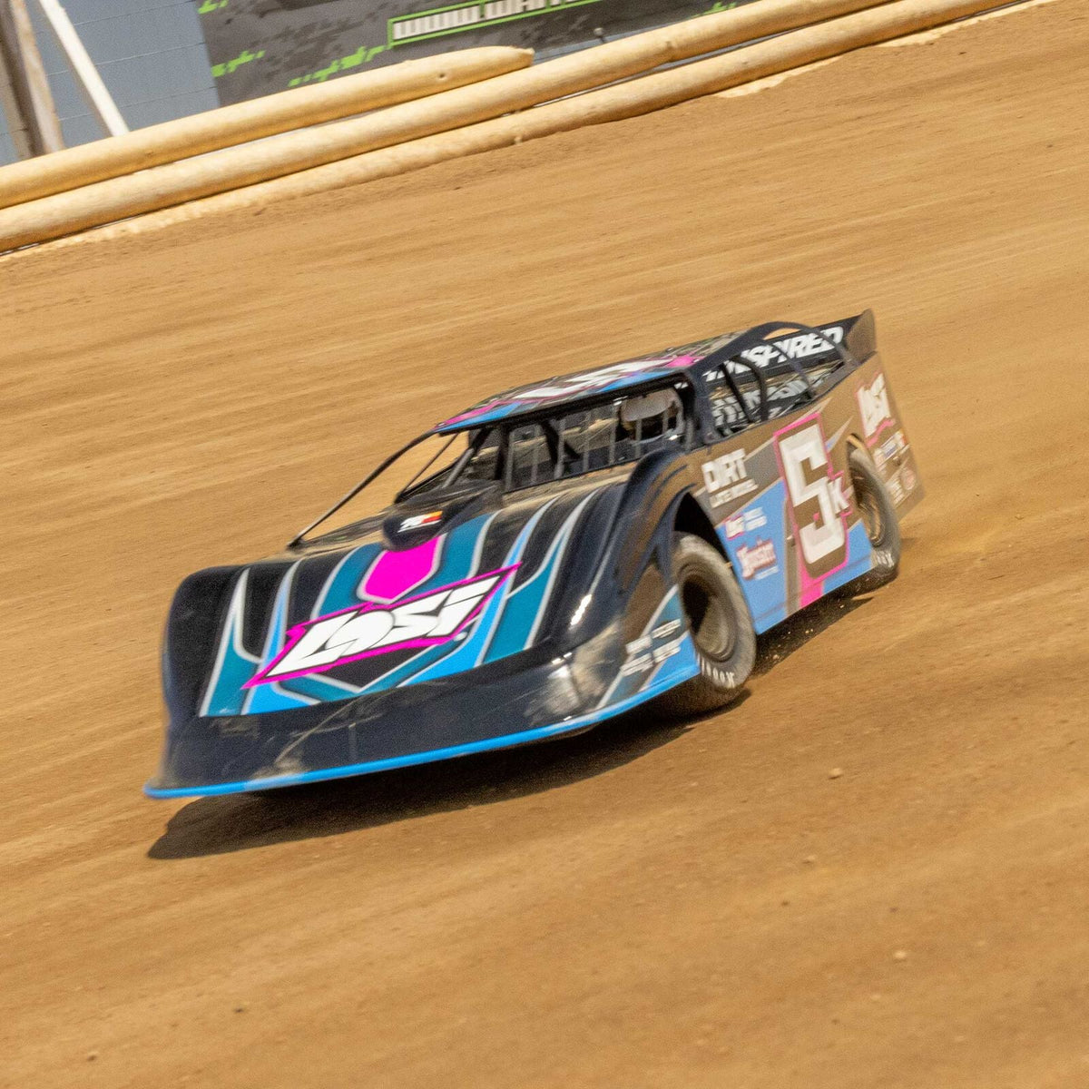 Losi 22S Dirt Late Model sliding on a clay oval